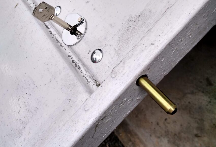 Key operated concealed security bolt on garage door