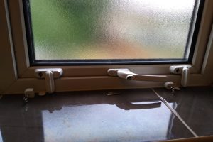Sash stoppers on window