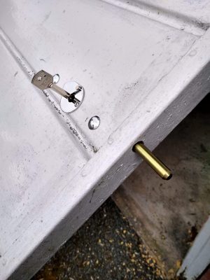 Key operated concealed security bolt on garage door