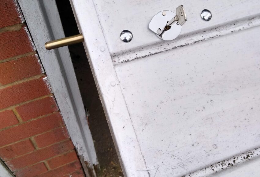 Key operated concealed security bolt on garage door